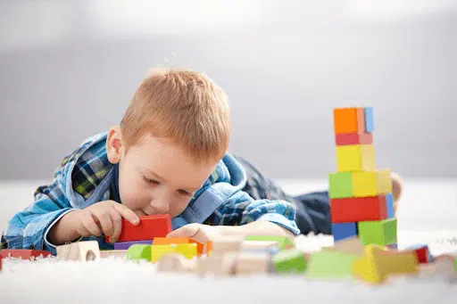 Young boy playing with blocks, Boosting Memory and Retention
