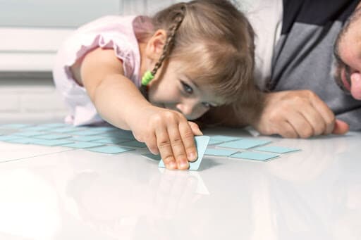 Child playing a memory card game