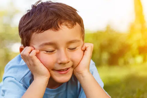 Nurturing intuition in kids, young boy with eyes closed