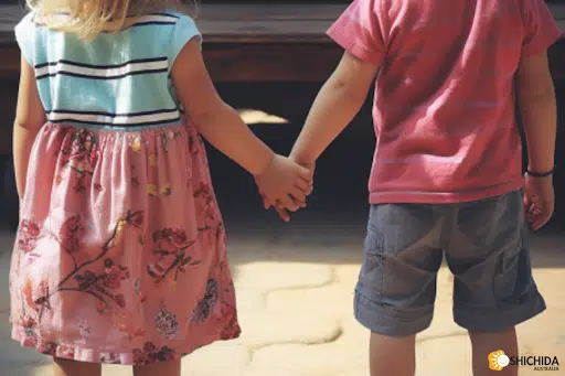 Young kids holding hands