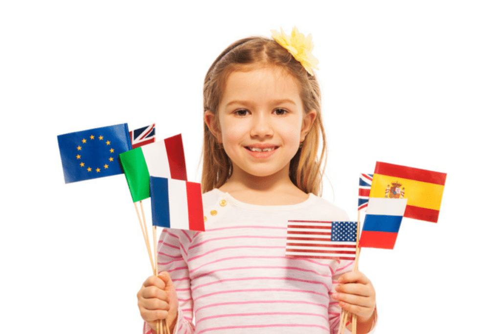 A young girl with several national flags of different countries