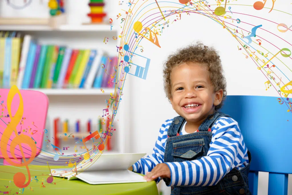 Cognitive benefits of music in early learning, young child with musical notes around them