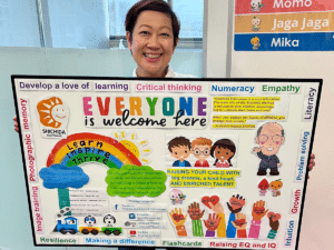 Friendly instructor with parent information board