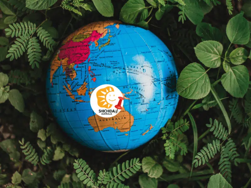 Shichida method in Australia - A globe showing Australia and the Shichida Australia logo