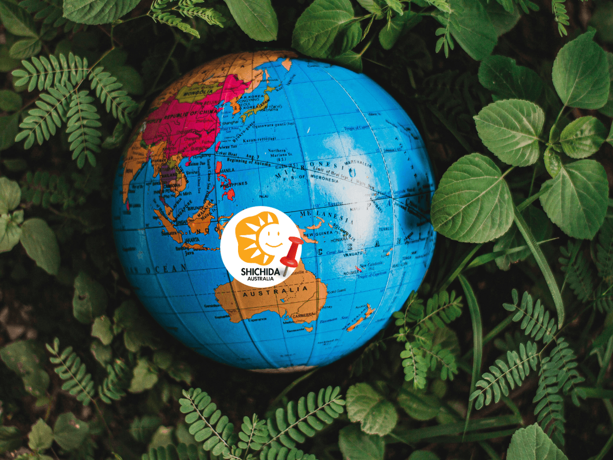 Shichida method in Australia - A globe showing Australia and the Shichida Australia logo
