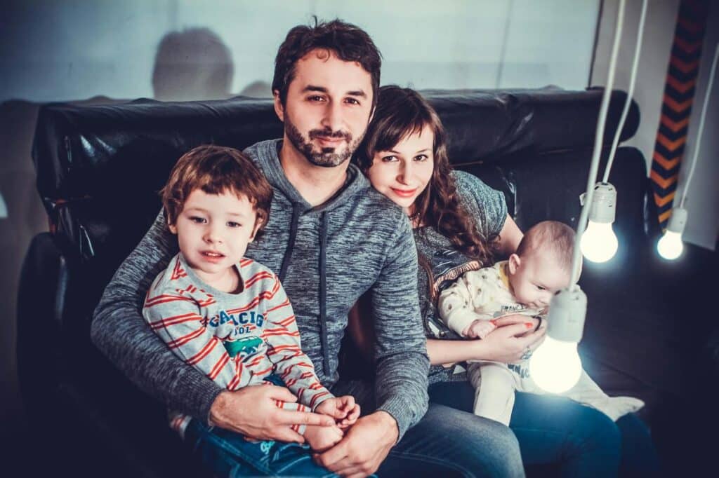 5 Common Parenting Mistakes featuring a mum, dad and two young kids