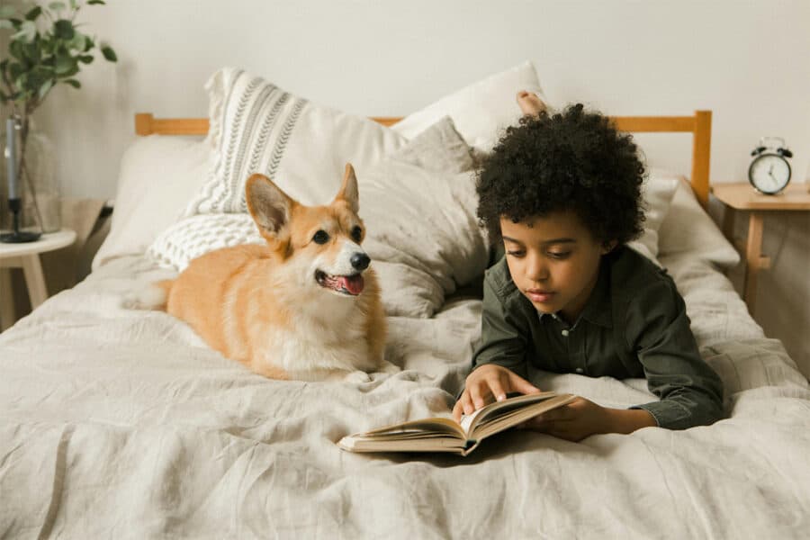 A child reading a book - reading books within the correct Reading Lexile range enhances the reading journey.