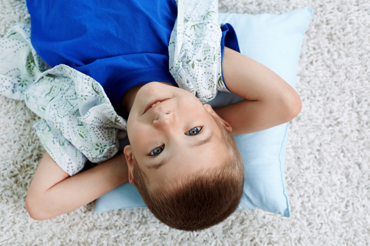 A young boy relaxing showing the benefits of meditation for kids