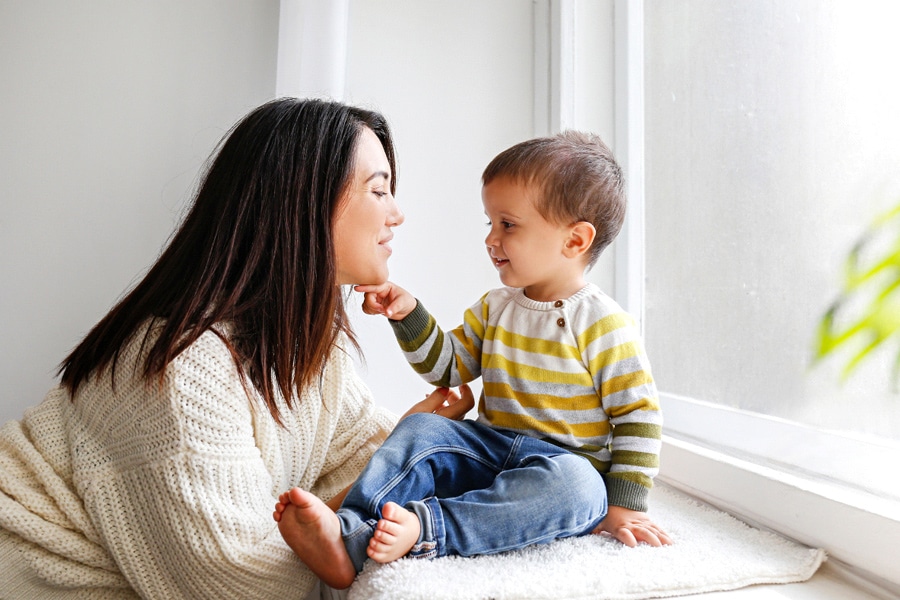 Kids mental health is improved by parental engagement, here a mum is spending quality time with her toddler.