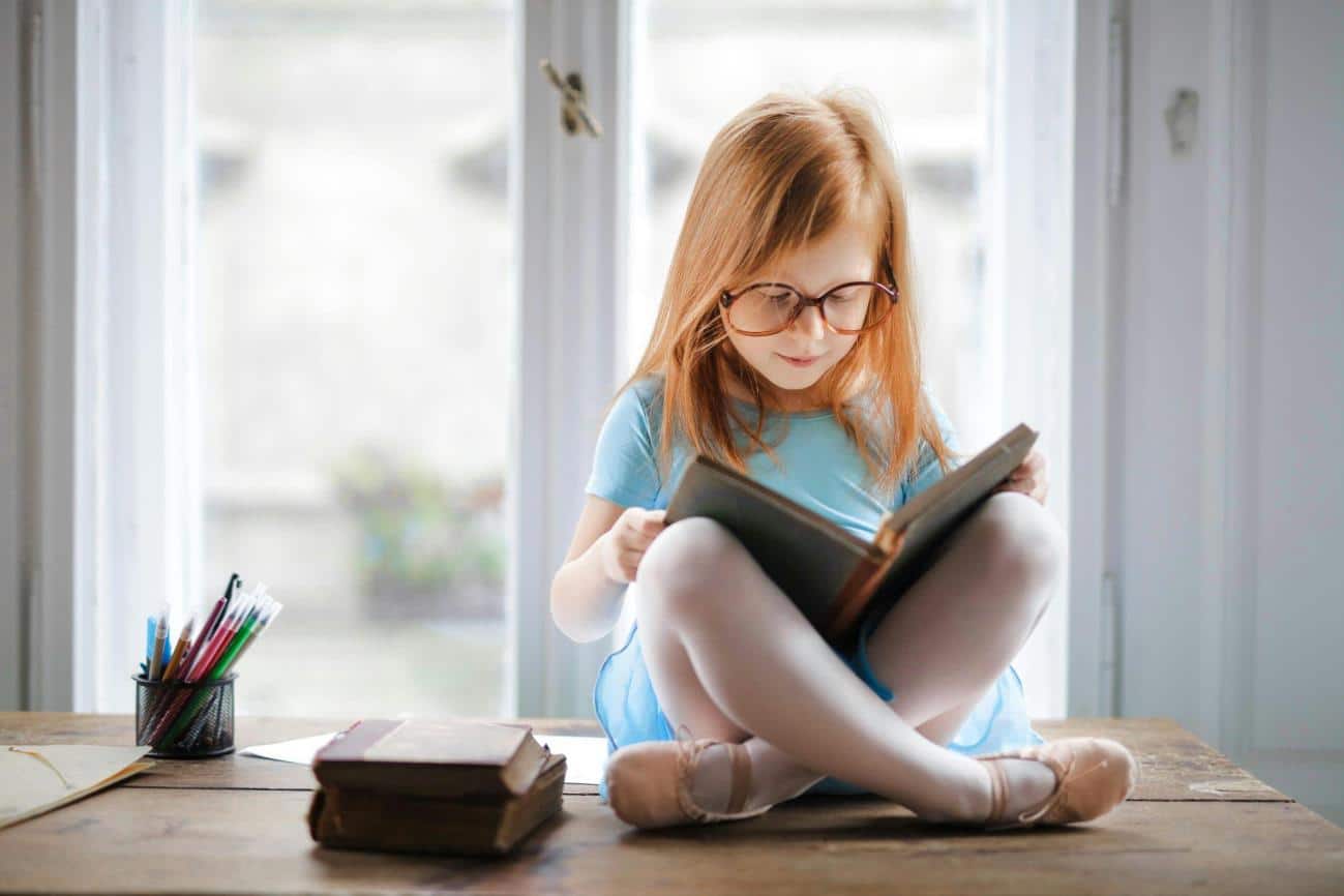 Reading opens doors, storytelling is a great skill, here a young girl reads a book