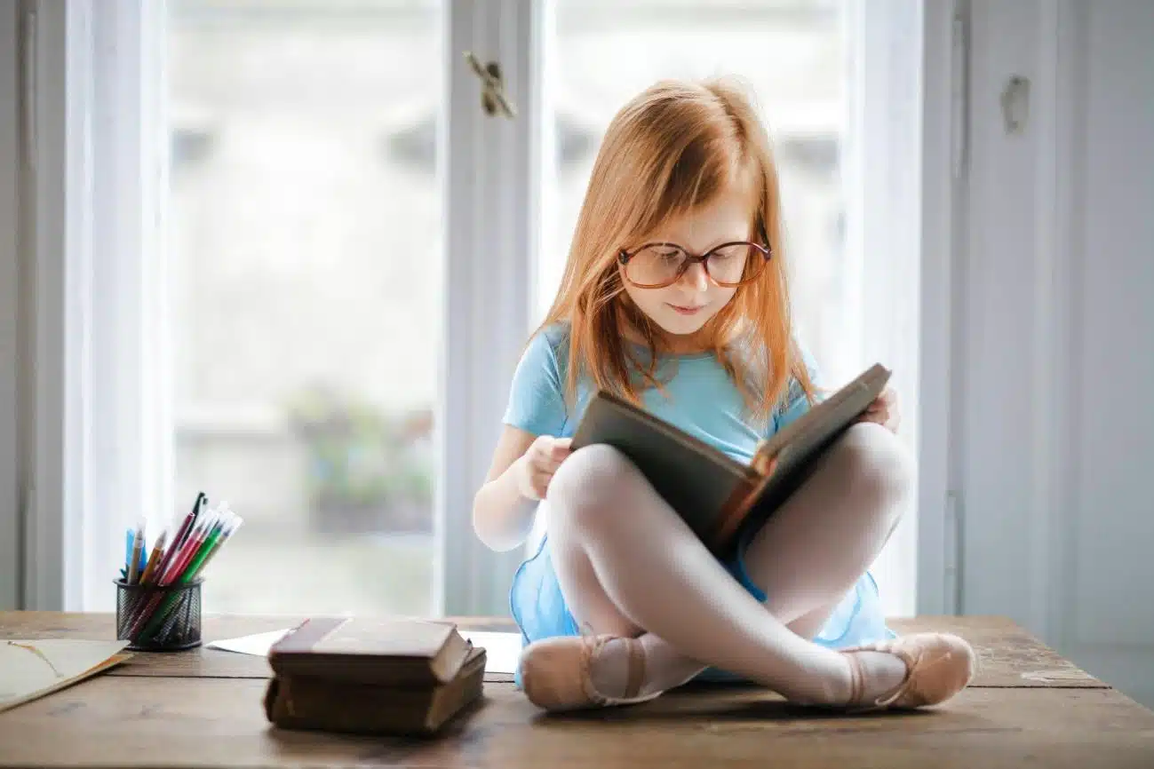 Reading opens doors, storytelling is a great skill, here a young girl reads a book