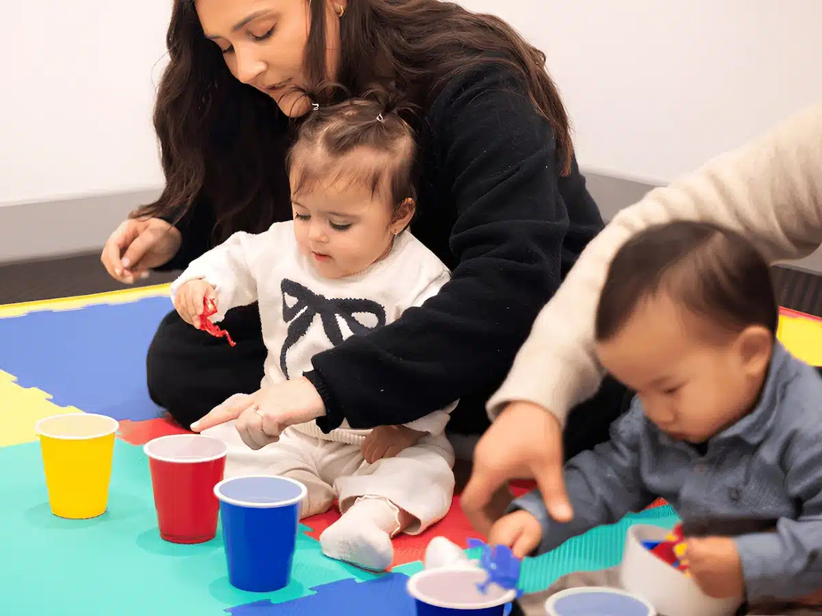 babies playing a colour matching game during a Shichida class