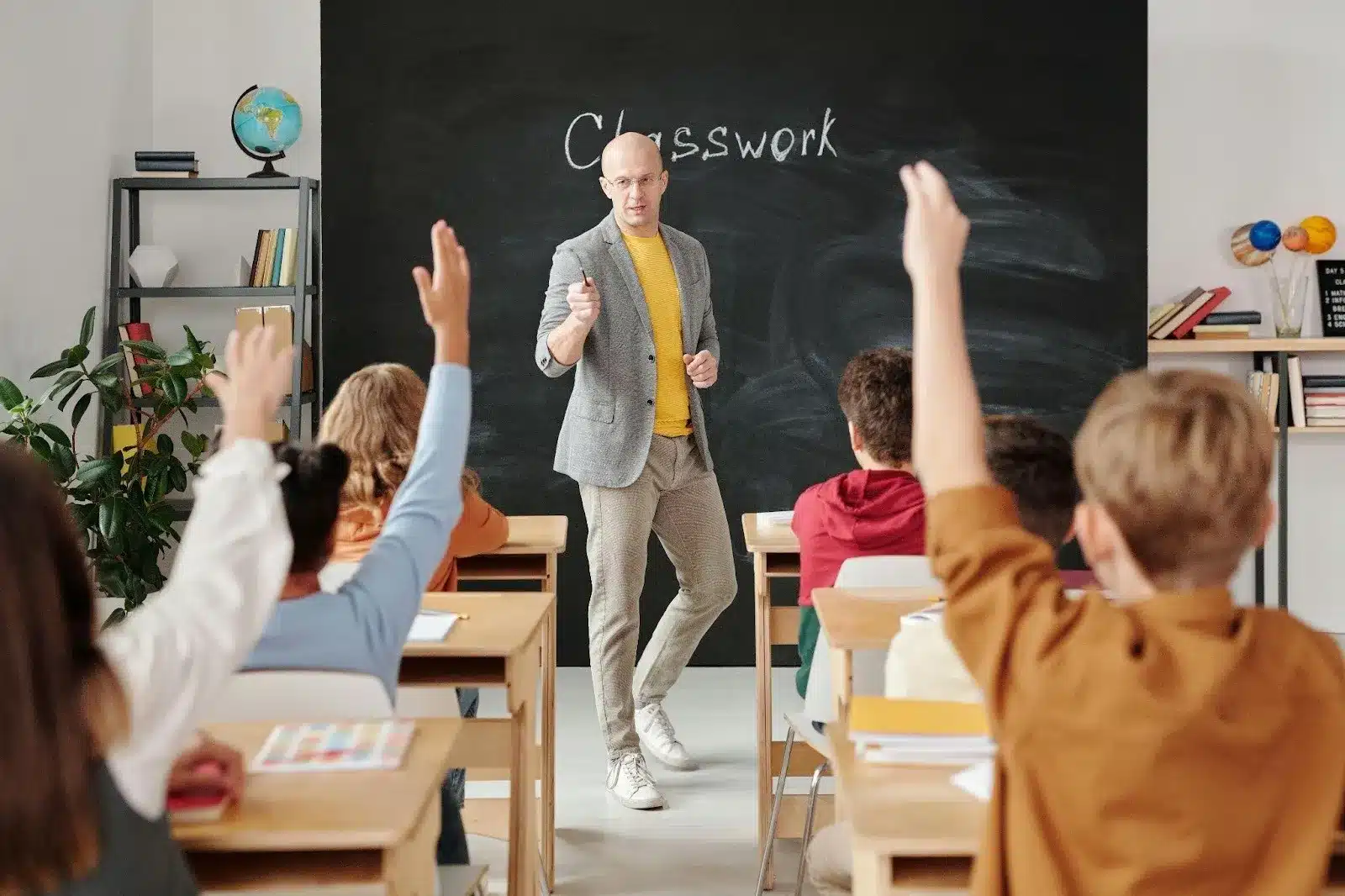 teacher classwork student raise hands