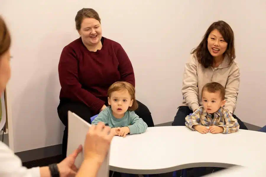 adults-children-table-group-Preschools in Melbourne