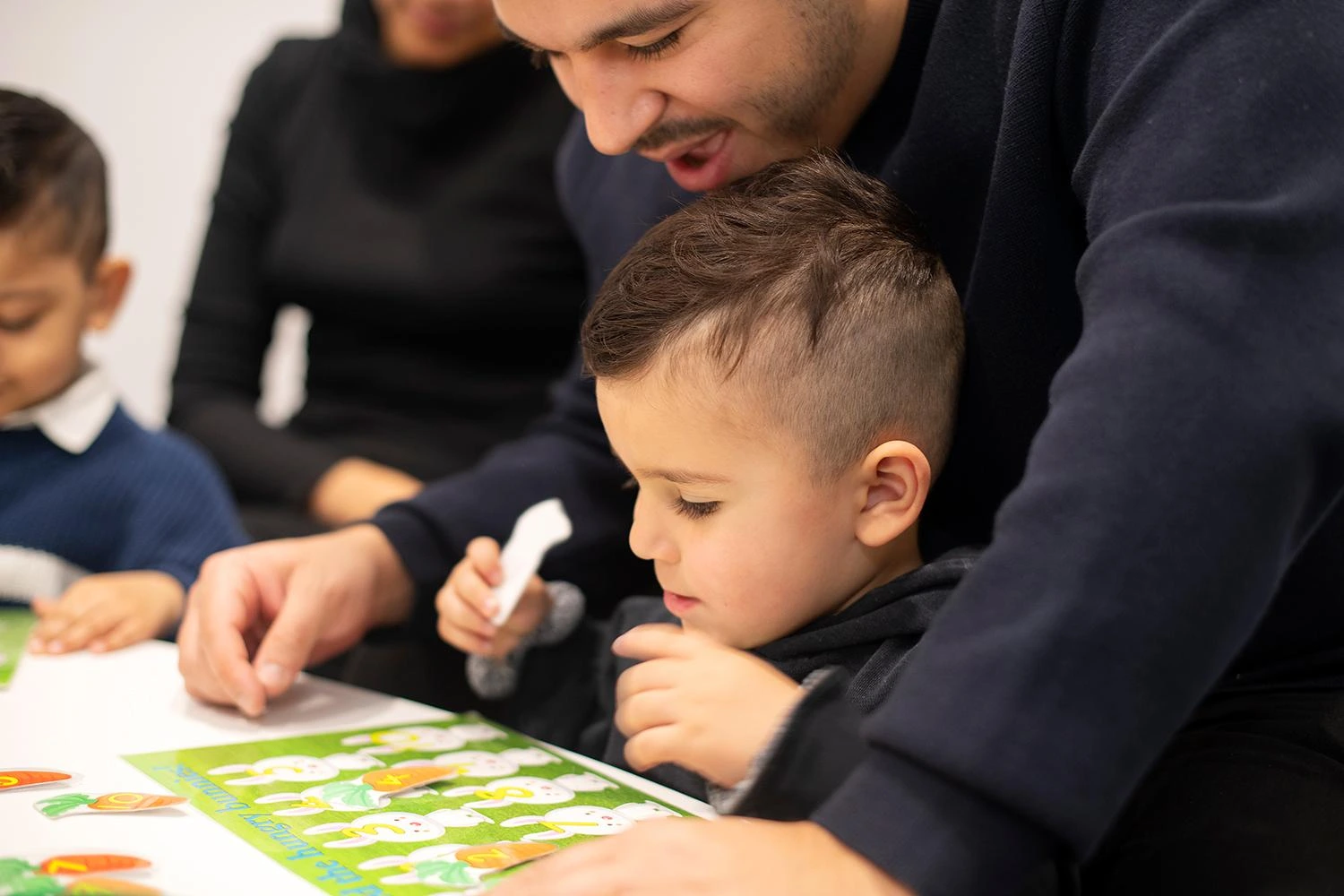 family-playing-with-puzzle