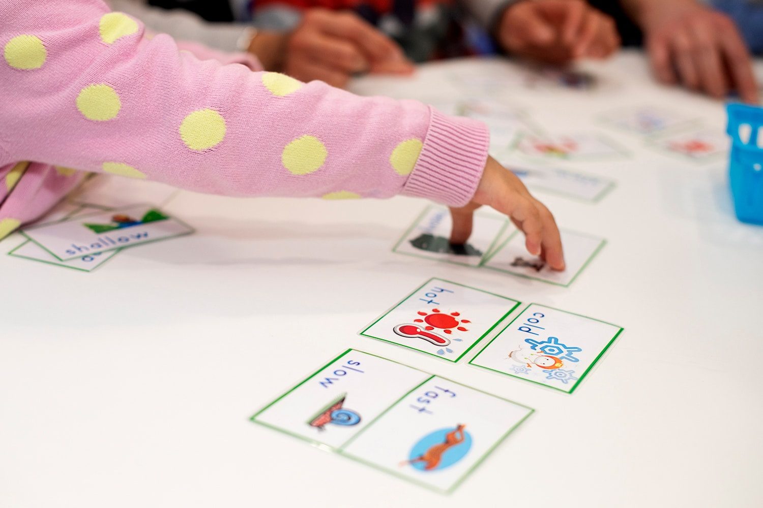 Vocabulary for kids, kids matching opposite cards with words and images in a Shichida class
