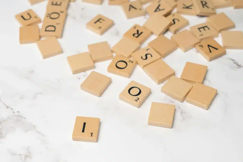 letter recognition games at home - scrabble letter tiles on a table top